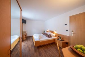 Postel nebo postele na pokoji v ubytování Hotel Christoph