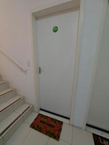 a door with a welcome mat in front of it at Condomínio São Francisco in Petrolina