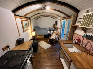 a kitchen and living room in a tiny house at The carriage in Three Cocks Junction