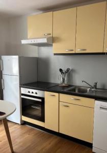Η κουζίνα ή μικρή κουζίνα στο Appartement Famille