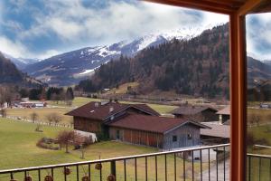 a view of a mountain from a window of a house at Haus MUMO in Bad Hofgastein