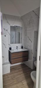 a bathroom with a sink and a mirror at Campanile 17 in Manfredonia