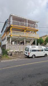 a white van parked in front of a building at Valo's 360 Services in Portsmouth