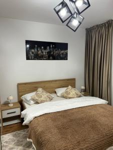 Кровать или кровати в номере Jasminique Suite