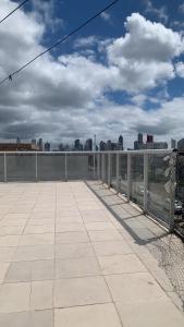 a balcony with a view of a city skyline at Casa do hóspede in Balneário Camboriú