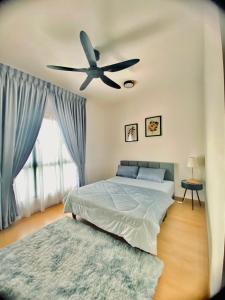 Uma cama ou camas num quarto em KaiSplash Splashmania Gamuda Cove
