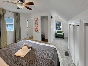 a bedroom with a bed with a hat on it at Coffee Lover's Paradise - Heart of Tremont in Cleveland