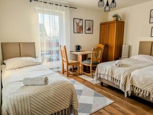 Posteľ alebo postele v izbe v ubytovaní Willa Konda - bania , sauna