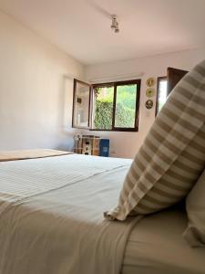 Ένα ή περισσότερα κρεβάτια σε δωμάτιο στο El cuartito Iguazu