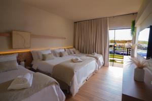 Postel nebo postele na pokoji v ubytování Morro dos Anjos Águas Quentes Hotel Resort OFICIAL
