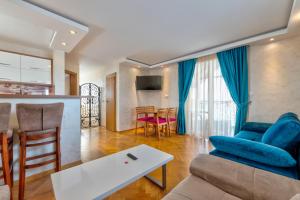 a living room with a couch and a table at Vila Romantika in Zlatibor
