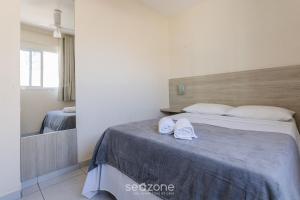 Ένα ή περισσότερα κρεβάτια σε δωμάτιο στο Apto c/ 3Q a 150m da Praia do Morro TML501