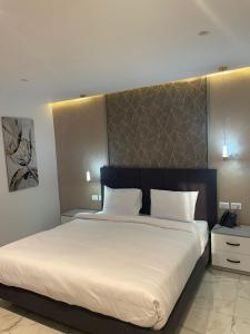 Voodi või voodid majutusasutuse El Mesaadya Hotel فندق المساعدية toas