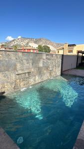 a large pool of water in a retaining wall at VillaLuxury in Dúrcal
