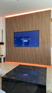 a flat screen tv hanging on a wall at VillaLuxury in Dúrcal