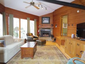 a living room with a couch and a fireplace at Slopesider 23C condo in Sugar Mountain