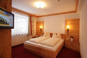 Krevet ili kreveti u jedinici u okviru objekta Hotel Ritterhof Ellmau