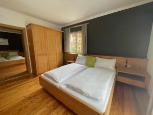 a bedroom with a large bed in a room at Ferienhaus Antonia in Dorfgastein +45 photos
