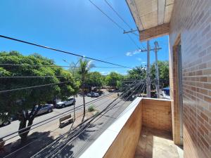 a balcony with a view of a street at Casa em Stella Maris, 1km da praia - Excelente localização! in Salvador