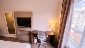 Cama ou camas em um quarto em Holiday Inn Belo Horizonte Savassi by IHG