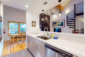 a kitchen with a sink and a dining room at Squaw Valley Ski Flat in Olympic Valley
