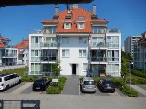 a large white building with a red roof at Meeresrauschen 6 in Großenbrode