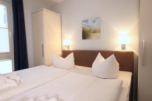 Ein Bett oder Betten in einem Zimmer der Unterkunft Strandvilla Baabe 10 HERZMUSCHEL