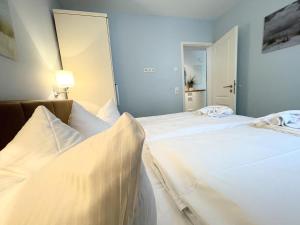 Ein Bett oder Betten in einem Zimmer der Unterkunft Strandvilla Baabe 10 HERZMUSCHEL