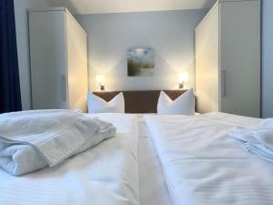 Ein Bett oder Betten in einem Zimmer der Unterkunft Strandvilla Baabe 10 HERZMUSCHEL