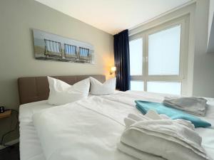 Ein Bett oder Betten in einem Zimmer der Unterkunft Strandvilla Baabe 10 HERZMUSCHEL