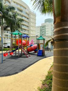 a playground with a slide and a play equipment at Vista inesquecível para o mar homeclub BetoCarrero in Penha