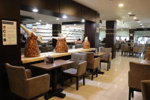 Restoran või mõni muu söögikoht majutusasutuses Wyndham Garden Aguascalientes Hotel & Casino