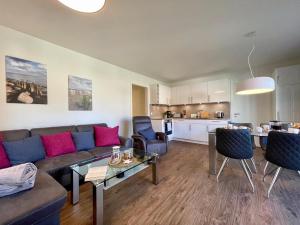 a living room with a couch and a table at Dahmer Strand 9 in Dahme