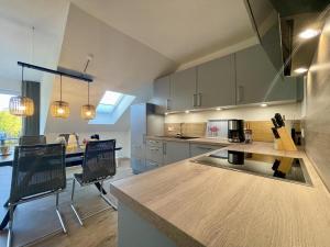 a large kitchen with a counter top in a room at Dahmer Strand 12 - MEERESBRISE in Dahme +20 photos