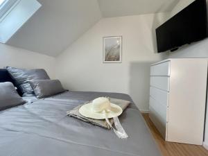 Postel nebo postele na pokoji v ubytování Kellenhusen Tor 6