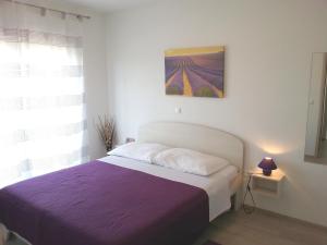Postel nebo postele na pokoji v ubytování Apartments Levanat
