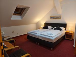 Voodi või voodid majutusasutuse Hotel Bílý Koníček toas