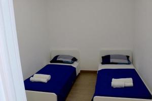 Postel nebo postele na pokoji v ubytování NelBlu B&B