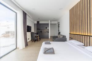 Postel nebo postele na pokoji v ubytování New Gudauri View Hotel