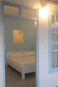 Postel nebo postele na pokoji v ubytování A.V.N HOMESTAY