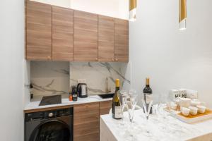 a kitchen with wine glasses on a counter at Paix in Paris +8 photos