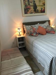 Ένα ή περισσότερα κρεβάτια σε δωμάτιο στο Quarto & Conforto