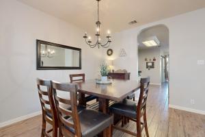 a dining room with a table and chairs at Living the Dream in San Antonio