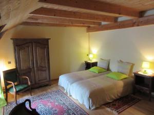Кровать или кровати в номере Bastides Du Mezenc