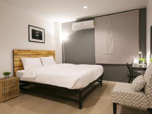 Voodi või voodid majutusasutuse Sleeping Well Chiangkhong toas