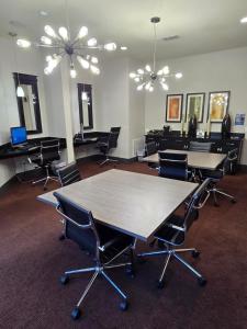 an office with tables and chairs in a room at 2bdrm/2 King beds/1Air mattress in Dallas +41 photos