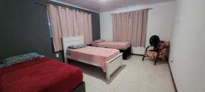 Postel nebo postele na pokoji v ubytování Cantinho do aconchego