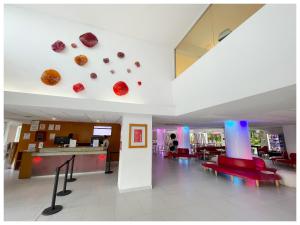 a lobby with donuts on the ceiling of a building at Adhara Express in Cancún +27 photos