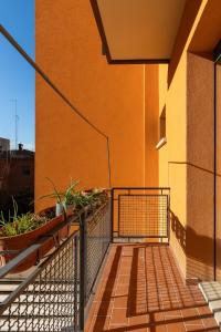 a balcony with a fence and a building at Oasis Apartment in Bologna