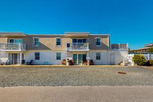 a large house with a large driveway in front of it at HB289 Feel the Burn in Holden Beach